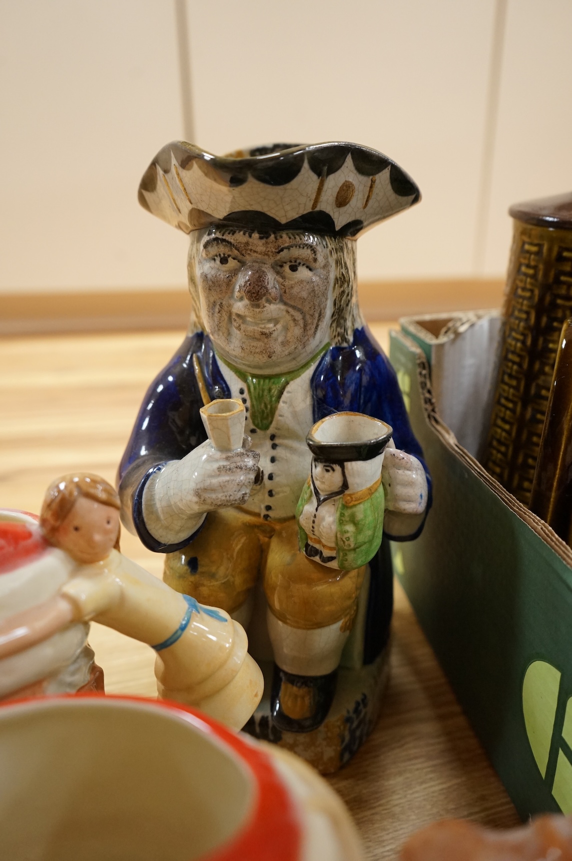 A collection of ceramics to include Doulton Toby jugs, Goebel figurines and Adderley part tea set